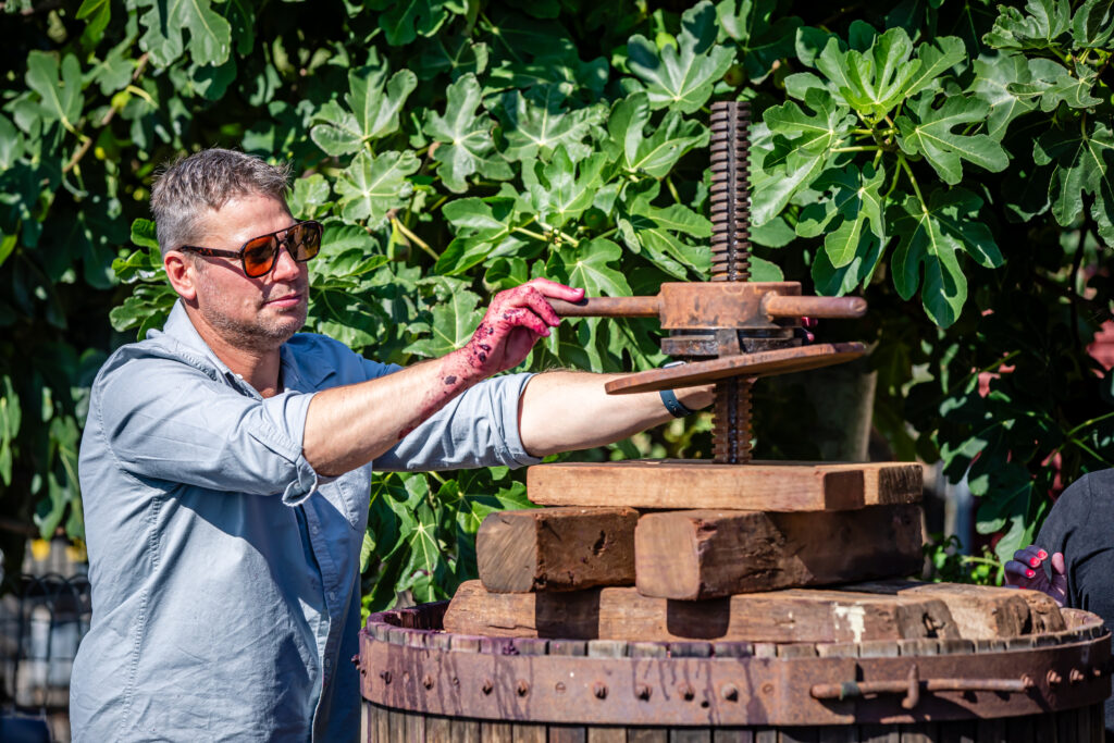 Steven Raidis operates the basket press
